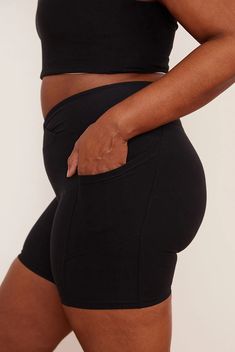 Introducing the Onyx Midi Bike Short, which is quite possibly the most flattering short you’ll ever own. Available in a classic black, featuring pockets, a crossover waistband, and ruched detailing, these shorts will have you spending a little too much time in the mirror, eyeing your behind. Made using post-consumer recycled plastic — 84% RPET and 16% spandex. Recycled Bottles, Active Shorts, Full Figured, Sustainable Clothing, The Mirror, Recycled Fabric, Bike Shorts, Shorts With Pockets, Recycled Plastic