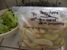 a bag of sliced apples next to a bowl of lettuce