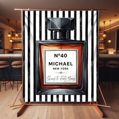 a black and white striped backdrop with a bottle of michael new york