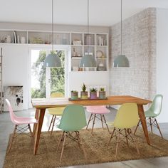 a dining room table and chairs in front of a brick wall with open shelving