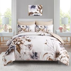 a bed with white and brown flowers on it