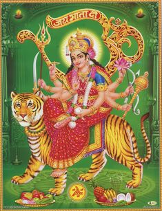 the hindu god sitting on top of a tiger