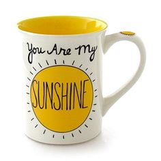 a yellow and white coffee mug with the words you are my sunshine on it's side