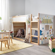 a child's bedroom with bunk beds and toys