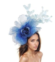 Hats By Cressida Ascot Fascinators, Wedding Hats & Kentucky Derby Hats Royal Baby Blue Hayley Feather and Silk Fascinator A mass of blue feathers surround a large silk royal and baby blue rose flower Flower is about 10 inches wide, feathers about 8-10 inches We can do this in many colours Mounted with a matching headband. If you prefer a headband to match your hair, please make a note at check out what colour headband you want. The Hayley Fascinator Hat is perfect for any special occasion, whether it's a glamorous horse race like the Kentucky Derby or a formal affair like Royal Ascot. This stunning hat features a large silk rose flower, surrounded by a gorgeous mass of feathers, making it a truly elegant headpiece. It's perfect for the mother of the bride or any woman in need of a formal h Blue Summer Fascinator Hat, Light Blue Headpiece For Royal Ascot Party, Blue Summer Wedding Costume Hats And Headpieces, Spring Blue Fascinator For Garden Party, Blue Spring Fascinator For Garden Party, Blue Costume Hats And Headpieces For Summer Wedding, Light Blue Headpieces For Spring Wedding, Blue Fascinator For Royal Ascot Garden Party, Blue Fascinator For Garden Party At Royal Ascot