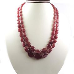 2 Lines Of Natural African Ruby Necklace - Smooth Oval Necklace - Gemstone Precious Necklace 21mmx14mm-11mmx9mm PN027Specifications:-Gemstone - African RubyShape - Oval (Smooth)Size-21mmx14mm-11mmx9mm Length - 22 InchesBeads-65+Carat-990Beautiful layered  precious long Necklace. The necklace can be adjusted according to the neck size.Amazing quality at the best price around!!! Bulk wholesale orders are welcome on this item and any others in my shop, convo me for pricing information. Oval Beads Gemstone Necklace For Gift, Red Oval Gemstone Beads Jewelry, Red Oval Gemstone Bead Jewelry, Red Oval Jewelry With Gemstone Beads, Red Oval Gemstone Beaded Jewelry, Oval Necklace With Natural Stones For Formal Occasions, Oval Single Strand Necklace For Anniversary, Faceted Oval Necklaces For Anniversary, Oval Faceted Necklace For Anniversary