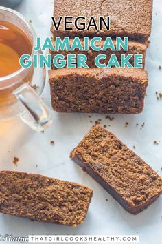 vegan jamaican ginger cake is cut into slices and placed next to a cup of tea