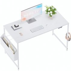 a white desk with a computer on it