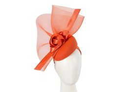 This elegant creation by Fillies Collection is expertly crafted by our milliners in Melbourne. Orange woolen pillbox base embellished with tall crinoline and silk abaca loops and sails. You can't pass this racing fascinator for your next autumn or winter racing carnival.  Made in Australia  Respected Fillies Collection brand  Autumn / Winter racing fascinator  Headband Elegant Orange Formal Hat, Adjustable Orange Fascinator For Evening, Orange Fascinator For Kentucky Derby Races, Elegant Orange Fascinator For Royal Ascot, Elegant Orange Fascinator For Races, Elegant Orange Fascinator For Formal Occasions, Elegant Orange Fascinator For Formal Events, Orange Mini Hats For Kentucky Derby Evening, Orange Spring Evening Fascinator