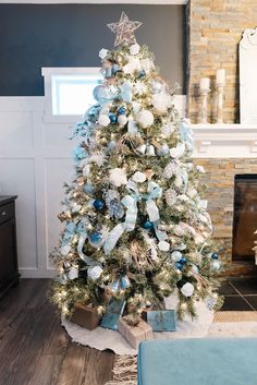 a decorated christmas tree with blue and white ornaments