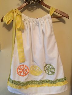 Lemonade  Party Dress with appliquéd  lemons, limes, and oranges !!!!!  A One of a Kind dress with a yellow gingham bow! by SoSewSweetCreations on Etsy https://www.etsy.com/listing/542143019/lemonade-party-dress-with-appliqued Cotton Lemon Print Dress For Garden Party, Cute Yellow Dress For Picnic, White Cotton Easter Dress, Yellow Cotton Dress For Picnic, Green Lemon Print Dress For Garden Party, Summer Lemonade, Lemonade Party, Yellow Gingham, Yellow Bow