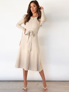 Indulge in luxury with our Robin Tie Waist Sweater Midi Dress in chic apricot. The tie waist accentuates your figure while the midi length adds a touch of sophistication. Made from a soft and comfortable knit, this dress is perfect for all-day wear. Elevate your style with this exclusive piece. Size Guide: Model is 5’8” tall, and has a 33.5” bust, 26.4” waist, & 35.6” hips. She is wearing a S / US 4 / AU 8. This sweater dress is true to size. Material: 100% Cotton. Feature: Crew neckline. Ruched shoulder. Long sleeves. Ribbed Soft knit fabric. Tie Waist. Midi length. Relaxed fit. Care Instructions: Machine wash / Cold hand wash Midi Dress Outfit, Retro Mode, Puff Long Sleeves, Sweater Dress Midi, Long Sleeve Midi, Mid Length Dresses, Perm, Fashion Colours, Black Midi Dress