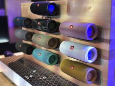 there are many different colored speakers on the wall