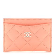 This is an authentic CHANEL Caviar Quilted Card Holder in Coral. This chic cardholder is crafted of luxurious diamond quilted caviar leather in orange. The pouch features a silver Chanel CC logo on the front and card slots on either side of the main compartment. Chanel Caviar, Cc Logo, Diamond Quilt, The Pouch, Card Slots, Slots, Card Holder, Coral, Chanel