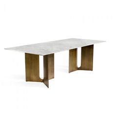 a white marble and brass dining table