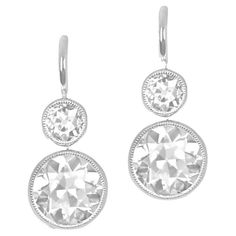 Indulge in elegance with these diamond earrings boasting bezel-set old European cut diamonds. Each earring showcases two diamonds—a larger bottom pair weighing 2.80 carats combined, in L color and VS1 clarity. The top diamonds, weighing 0.51 carats combined, add a touch of brilliance. Meticulously handcrafted in platinum and completed with Euro-backs, these earrings radiate timeless allure. Clarity: VS1 Color: L Color Material: Platinum Stone: Diamond Stone Cut: Old European Total Weight: 5.66 G Classic White Gold Earrings With White Topaz, Platinum Diamond Earrings With Rose Cut Diamonds, Platinum Diamond Earrings With Rose Cut, Platinum Rose Cut Diamond Earrings, Timeless Rose Cut Diamond Earrings, Classic White Diamond Earrings With Rose Cut, Classic Platinum Rose Cut Diamond Earrings, Timeless Rose Cut Diamond Earrings For Formal Occasions, Platinum Earrings With Rose Cut Diamonds In Diamond White