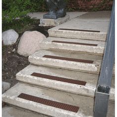 there is a statue sitting on the steps