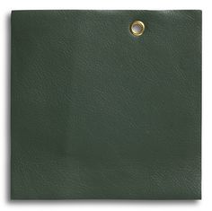 a green leather texture with a gold ring on the center and two holes in the middle