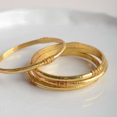 Need a wardrobe refresh? Add some flash and flair to your everyday look with our stunning new bangles by Julie Vos. Each piece is handcrafted, set in 24k gold plate, and sealed to prevent tarnish, making it the perfect touch of intrigue and glamour to your daily life. voss, julia, jewelry, bracelet Simple Gold Bangle Kameswari Jewellers, Cheap Everyday Bangle Jewelry, Cheap Elegant Gold Bangle, Affordable Classic Gold Bangle, Cheap Classic Round Bangle, Luxury Gold Plated Everyday Bangle, Cheap Classic Gold Bangle, Cheap Traditional Style Bangle Jewelry, Cheap Gold Bangle Bracelets