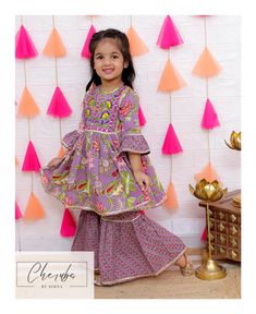 From baby girls to tweens, this modest sharara set in a beautiful purplish lavender shade is perfect for Eid, Diwali, weddings, and other festive celebrations. Made from soft cotton, it's designed for both comfort and style. Available in sizes 12 months to 10 years, this outfit brings elegance and tradition together. Ships fast from the USA! Lavender Sharara For Eid Festivities, Festive Lavender Sharara For Eid, Festive Purple Ruffle Dress, Festive Purple Ruffled Dresses, Festive Purple Dress With Ruffles, Festive Purple Cotton Dress, Long Sleeve Purple Sharara For Eid, Purple Cotton Anarkali Set, Festive Purple Cotton Sets