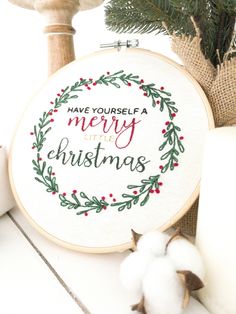 a cross stitch christmas ornament with the words have yourself a merry little christmas