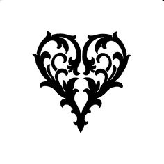 a black and white image of a heart with an ornament in the middle