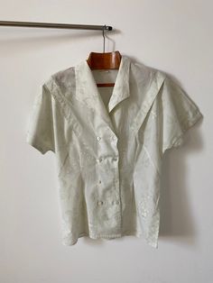 "Vintage double breasted cotton blouse for women Size 38 | Short Sleeve Blouse with delicate floral print. The greenish off white blouse has a fitted waist and a lovely sleeve pleated detail. Just a beautiful romantic summer blouse, great with jeans, shorts, skirts too. Composition: probably cotton. no composition tag attached.  Size: 38 Condition: excellent Measurements*: Armpit to armpit: 46 cm | 18.1\" Length: 68 cm | 26.8\" Waist: 42 cm | 16.5\" Hips: 50 cm | 19.7\" Shoulders: 40 cm | 15.7\" Spring Formal Cotton Blouse, Cotton Top For Wedding In Spring, Cream Short Sleeve Top For Wedding, Formal Cream Cotton Top, Cream Cotton Top For Formal Occasions, Spring Wedding Floral Print Tops, Classic Short Sleeve Tops For Wedding, Classic Floral Print Tops For Daywear, Formal Cotton Blouse For Summer