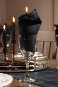 Make your holiday table stand out with the classic Black Watch tartan table runner. Its timeless navy, green, and black plaid design adds a sophisticated touch to your festive table setting, while also creating a cozy, relaxed feel for your country home. Perfect as a striking accent for your holiday dishes or as a stylish runner on your mantle, this versatile piece brings elegance and warmth to any décor. The tartan table runner is made of polyviscose fabric with a coordinating rolled hem edging Tartan Christmas Table, Medieval Christmas, Air Force Families, Festive Table Setting, Holiday Dishes, Canadian Maple Leaf, Black Watch Tartan, Stewart Tartan, Western Canada