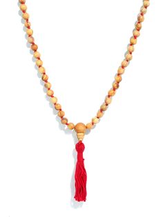 East meets West! The fragrance of Palo Santo wood from South America has now been strung into prayer beads commonly used by Hindus, Buddhists, and some Sikhs for the spiritual practice known in Sanskrit as Japa. The Guru bead is also made from Palo Santo wood. Knotting between beads for ease of moving fingers around the beads when saying prayers. This Mala is 41" in length not including the yarn tassel. 108 beads. 7/8 mm. Spiritual Wooden Beads Rosary For Meditation, Red Hand-strung Spiritual Mala, Red Handmade Mala For Healing, Red 8mm Beads Spiritual Mala, Red Hand-strung Mala For Healing, Spiritual Rosary With Wooden Beads For Meditation, Traditional Gemstone Beads Rosary For Meditation, Red Hand-strung Mala For Rituals, Adjustable Red Mala With 108 Beads