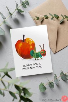 a card with an image of a caterpillar on it and the words hungry for a sweet new year