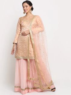 This is a beautiful 3 piece suit set. It comes with embroidered kurta has lace detailing, full sleeves, round neck, short length teamed with chinon sharara has sequin detailing with elasticated waistband and a net dupatta with sequin detailing 3 piece set Color- Peach Work- Embroidery work, Lace & Sequin Detailing Kurti Length-32 inch Kurta Fabric-Brocade Bottom Fabric-Chinon Dupatta Fabric-Net Sleeves-Full Sleeves Neck-Round Neck Care-Hand Wash or Dry Clean Long Sleeve Sets With Zari Work In Chinon, Unstitched Sets With Sheer Dupatta For Festive Occasion, Festive Unstitched Sets With Sheer Dupatta, Long Sleeve Palazzo Set With Sheer Dupatta For Wedding, Unstitched Embroidered Sharara For Celebration, Embroidered Unstitched Sharara For Celebration, Georgette Sets With Self Design For Eid, Bollywood Style Sets With Resham Embroidery And Straight Kurta, Unstitched Sets With Sheer Dupatta For Celebration