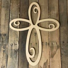 a wooden cross on a wood floor