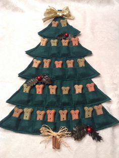 a christmas tree made out of small teddy bears