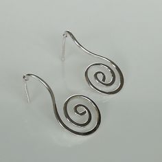 IMPORTANT **Please go through all the pictures i have posted for a listing with a ruler, on a model, on my hand, to get an exact idea of the actual size of the item. Sterling silver spiral dangle earring. Dimension: 15 x 29 mm Weight: 2.4 gm Price listed is for ONE PAIR. These earrings are made of 925 hypoallergenic sterling silver. All my pieces are sent in a gift box. I can include a personal message from you if needed. You are welcome to contact me at... bhavnakwintra1956@gmail.com More Silve Modern Spiral Earrings With Ear Wire, Modern Twist Silver Spiral Earrings, Silver Spiral Wrap Earrings In Sterling Silver, Unique Spiral Silver Earrings, Unique Silver Spiral Earrings, Unique Silver Swirl Earrings, Silver Swirl Pierced Earrings, Minimalist Sterling Silver Swirl Earrings, Unique Sterling Silver Swirl Earrings