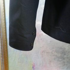 This Royal Navy dark blue wool sailor uniform shirt has, unsurprisingly, a wide Sailor collar, long sleeves with two navy buttons on the cuff, and a badge on the left upper arm with a crown above a stylized trident. The military Cracker Jacket naval shirt slips on, and is in excellent condition. Chest = 44 inches (111.76cm) (the extra space here allows a bit of room, but this is best fit for XL 42 US/UK) Shoulders = 19.5 inches (49.53cm) Sleeve Length = 27 inches (68.58cm) Shirt Length = 27 inch Business Peacoat With Button Cuffs And Long Sleeves, Business Peacoat With Button Cuffs, Wool Long Sleeve Tops With Button Cuffs, Long Sleeve Wool Tops With Button Closure, Wool Long Sleeve Tops With Button Closure, Classic Long Sleeve Peacoat With Buttons, Fall Long Sleeve Peacoat, Navy Single-breasted Pea Coat, Navy Pea Coat With Buttons For Work