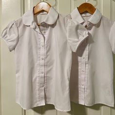 Two Tops, Girls Size 6/7, White Button Down, New Without Tags, Never Been Wash Or Worn. In Excellent New Condition. 65% Polyester And 35% Cotton Cotton School Uniform Sets, Cute Fitted Sets With Buttons, Classic Cotton School Blouse, Classic Collared Tops For School, Cute Fitted School Set, White School Uniform Sets, Classic Fitted Tops For School, Classic Fitted Blouse For School, Fitted Classic Blouse For School