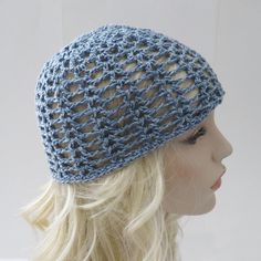 a crocheted hat is on top of a mannequin's head