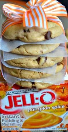 a stack of cookies sitting on top of each other next to a package of jello