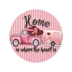 a pink truck with a heart on it and the words home is where the heart is