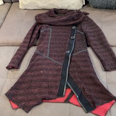 Beautiful New With Tag Nicole Sabbattini Wine & Black With Sequin Sweater Coat Size Small! Faux Buttons On The Outside And Snap Buttons On The Inside. 80% Acrylic / 20% Nylon. Hand Washable Approximate Measurements Laid Flat And Buttoned: - Shoulder To Shoulder: 16” - Pit To Pit: 17” (Bust: 34”) - Sleeve Length: 23.5” - Length From Back Collar: 34” To 37” (Uneven Length) Fitted Patchwork Long Coat, Fitted Long Patchwork Coat, Purple Long Sleeve Outerwear With Buttons, Fitted Purple Winter Outerwear, Fitted Patchwork Outerwear For Fall, Fall Lagenlook Outerwear With Patchwork, Long Sleeve Purple Outerwear For Cold Weather, Purple Long Sleeve Outerwear For Cold Weather, Burgundy Fitted Long Sleeve Outerwear