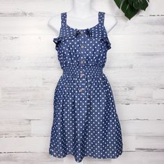 Great Dress For Spring And Summer. Flowy Sundress With Ruffle Details Can Be Dressed Up Or Down. Blue Background With White Polka Dots Anda Picodots. Button Details On Front. Elastic Waistband. Casual Country Feel. Size: Small (4/6) Fabric: Cotton Polyester Blend Measurements Taken Flat And Are Approximate Chest: 14" Waist: 10" (Elastic Waist) Length: 34" Condition: New With Tags W-F0190 Polka Dot Mini Sundress For Spring, Polka Dot Sundress Mini Dress For Spring, Casual Polka Dot Sundress For Summer, Spring Polka Dot Sundress, Polka Dot Sundress For Spring Day Out, Polka Dot Sundress For Spring And Summer, Polka Dot Sundress For Day Out, Polka Dot Sundress For Spring, Polka Dot Summer Dress With Buttons