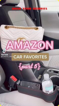 the interior of a car with an amazon bag and handbag in it's back pocket