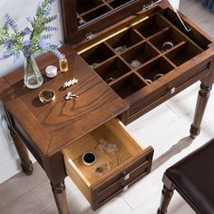 a wooden desk with drawers on top of it