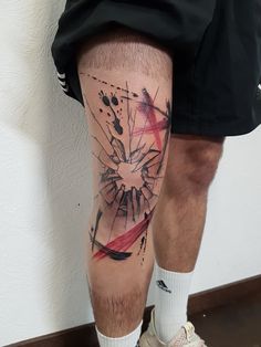 a man's leg with an abstract tattoo design on his left calf and the bottom half of his leg