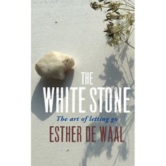 the white stone book cover with an image of a rock and some plants on it