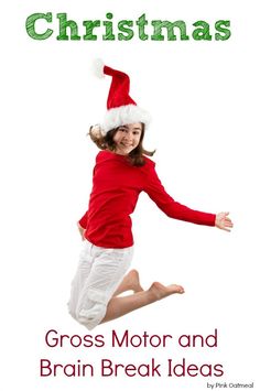 a girl in red shirt and white pants jumping up into the air with santa hat on