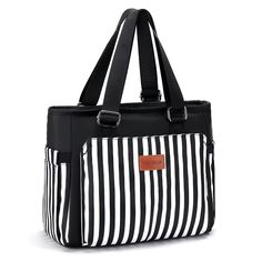 a black and white striped bag with leather handles