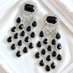 Add a touch of glamour to your look with our Elegant Bridal Crystal Tassel Earrings. Featuring a large pendant with shimmering black crystals and a graceful water drop design, these exaggerated dangle earrings are perfect for parties and special occasions. Ideal for brides and party-goers alike, these stunning earrings will ensure you stand out in any crowd. Material: Rhinestone Metals Type: Copper Item: Crystal Tassel Earrings Style: TRENDY *Note Delivery Time: Due to the current global crisis Unique Drop Earrings, Large Pendant Necklace, Exude Confidence, Pendant For Women, Large Earrings, Stunning Earrings, Drop Earring, Trendy Accessories, Water Drop