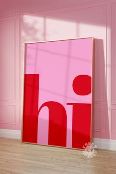 a pink wall with a red and white painting on it's side in an empty room