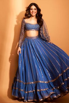 This set features a full sequin copper hand-embroidered lehenga with blouse and mirror border dupatta. Fabric: Dupatta - Net; Blouse - Georgette Color: Blue Care: Dry Clean Only About the Designer ... Modern Lehenga, Dull Blue, Lehenga With Blouse, Vani Vats, Chaniya Choli Designs, Mirror Border, Net Blouse, Simple Lehenga, Latest Bridal Lehenga